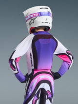 Alpinestars 2026 Youth Supertech Vista Jersey, Motocross Jersey, White Purple and Black with pink gradient accents, rear view on a youth rider wearing matching pants and a white helmet, athletic racing fit with mesh ventilation, professional motocross gear