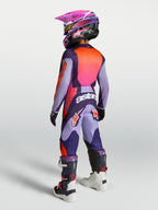 Alpinestars 2027 Youth Fluid Hunt Jersey and Gear Set in purple and pink fluo, rear view of youth motocross riding kit.