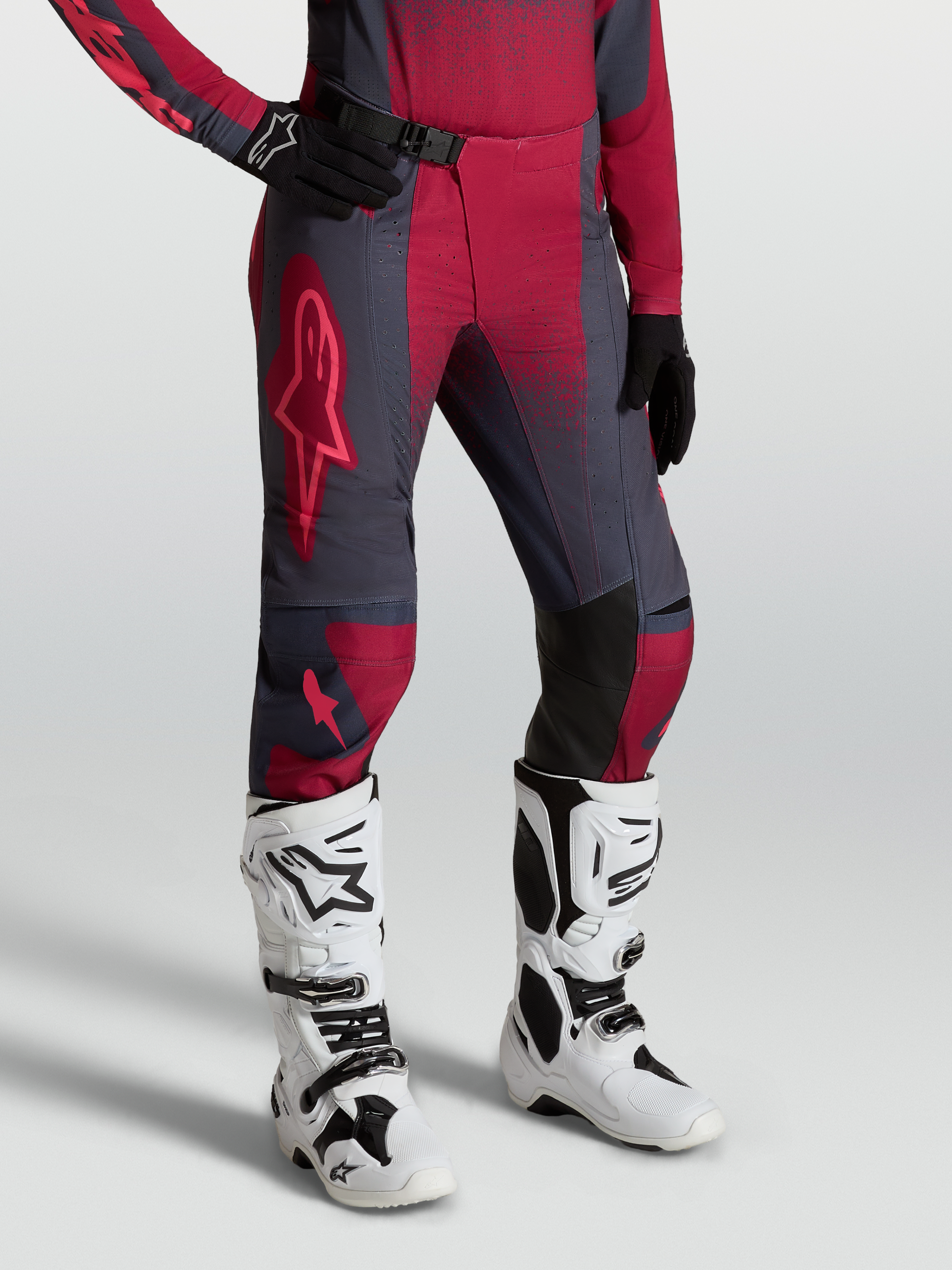 Alpinestars Stella Techstar Swan Pants, women's motocross gear, crimson and dark gray, worn with white Tech 10 boots.