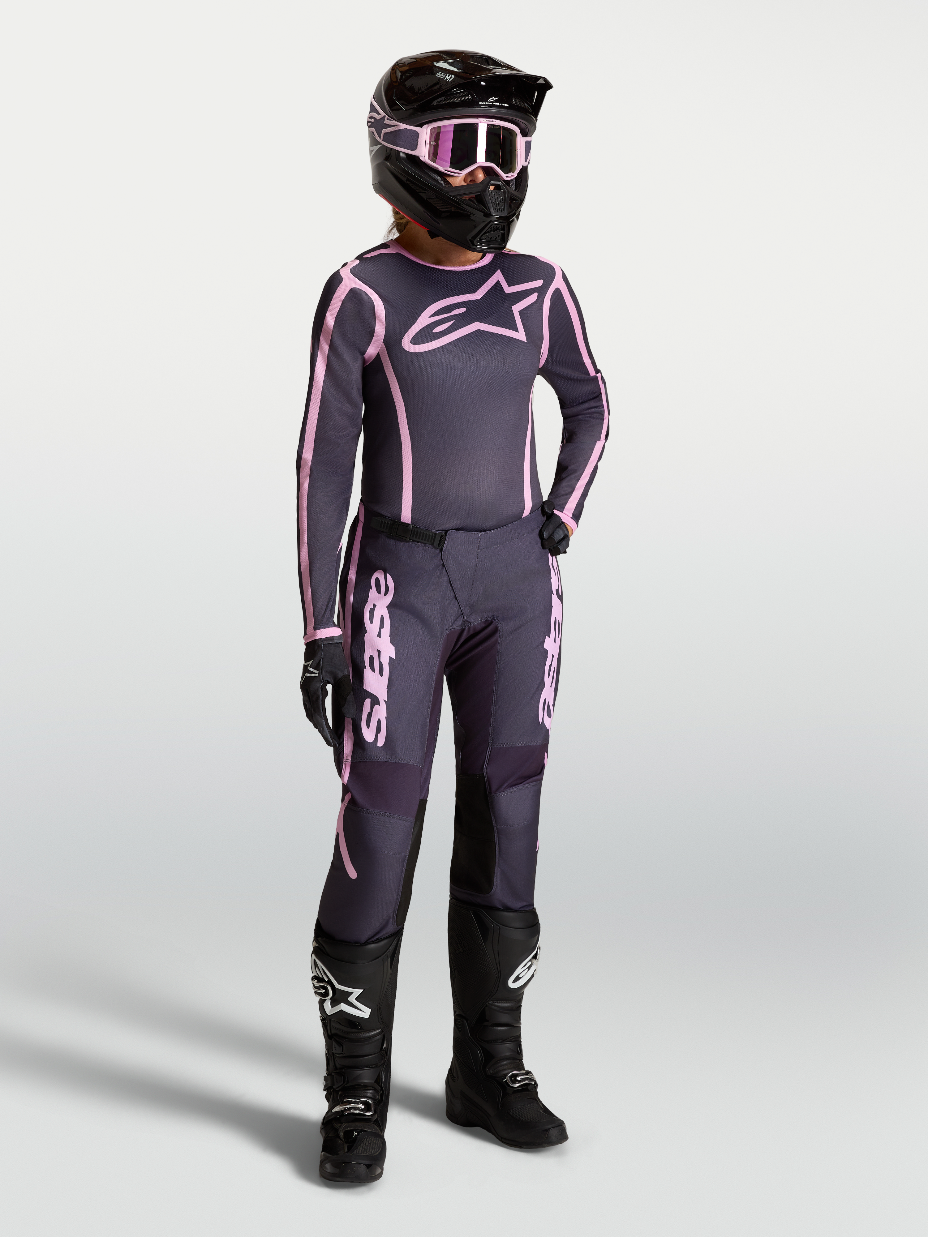 Alpinestars Stella Fluid Apex V2 Jersey and Gear Set, Women's Motocross Outfit in Graystone and Pink with black racing boots.