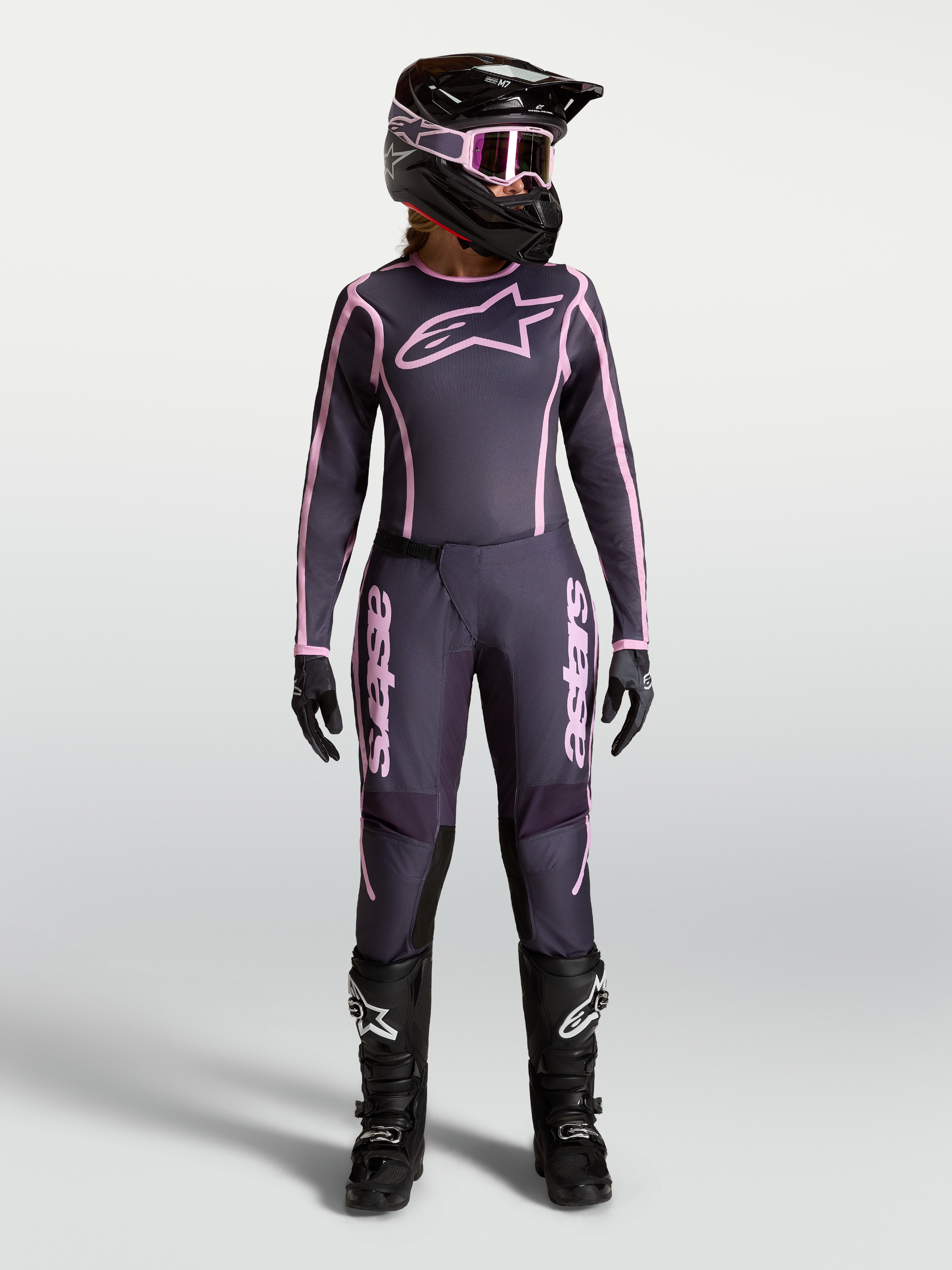 Alpinestars Stella Fluid Apex V2 Pants, Women's Motocross Gear, Graystone and Old Pink, featuring matching jersey and helmet.
