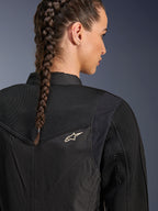 Alpinestars Stella T-Dyno Air Jacket, Women's Black Motorcycle Jacket, close-up back view showing 3D mesh panels on the yoke and upper back for airflow, featuring a small white star logo, worn by a model with braided hair.