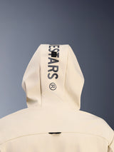 Alpinestars Radium Tech Hoodie in Mastic Aluminum, close-up back view of the hood showing vertical black Alpinestars branding and the hood attachment loop system, urban motorcycle apparel detail