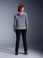 Alpinestars Stella Chrome V2 Sport Hoodie, Women's Motorcycle Hoodie, Gray Heather and Pink Fluo, back view showing pink Alpinestars logo on the hood, worn with black riding pants and boots, casual motorcycle apparel for women
