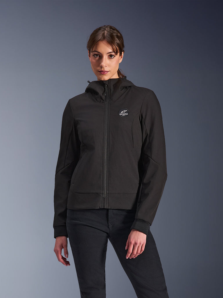 Alpinestars Stella Radium Tech Hoodie, Women's Motorcycle Hooded Jacket, Black, zip-up design with circular chest logo and hood, technical urban riding apparel, worn by model