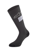 Alpinestars ZX V4 Socks, Black Auto Racing Socks, featuring white star logo and FIA certification label, knee-high seamless design with reinforced toe and heel, fire-retardant base layer for motorsport
