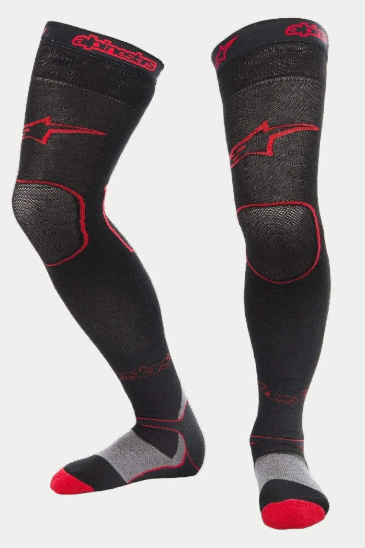 Alpinestars MX Long Tech Thick Socks, Motocross Riding Socks, Black and Red, featuring red Alpinestars logos on the thigh and cuff, gray heel and red toe accents, mid-thigh length with specialized mesh zones, technical base layer for off-road racing