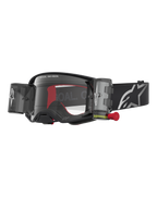 Alpinestars Supertech Firma Roll Off Goggles, premium motocross racing eyewear in black and silver, featuring a clear lens and integrated roll-off system for superior off-road visibility.