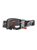 Alpinestars Supertech Corp Goggles Roll Off, Black frame with Clear lens, featuring a Wide Vision Roll-Off system and red pull tab, black strap with a large grey and white Alpinestars logo, technical motocross eyewear with "One Goal. One Vision." branding.