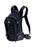Alpinestars AT-15 Back Pack, technical motorcycle backpack, Black and Deep Gray, featuring a rugged front MOLLE panel, adjustable compression straps, padded shoulder straps with magnetic chest lock, and All Terra logo, designed for adventure off-road riding