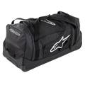 Alpinestars Komodo Travel Bag, large capacity gear bag, Black with white Alpinestars logos, featuring heavy-duty wheels, reinforced handles, and multiple zippered compartments for organized racing gear storage