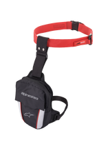 Alpinestars Access Thigh Bag, Motorcycle Thigh Bag, Black Red and White, featuring a red adjustable waist strap with quick-release buckle, black thigh strap, Alpinestars branding on the front flap, and reflective white panels with red accents for visibility.
