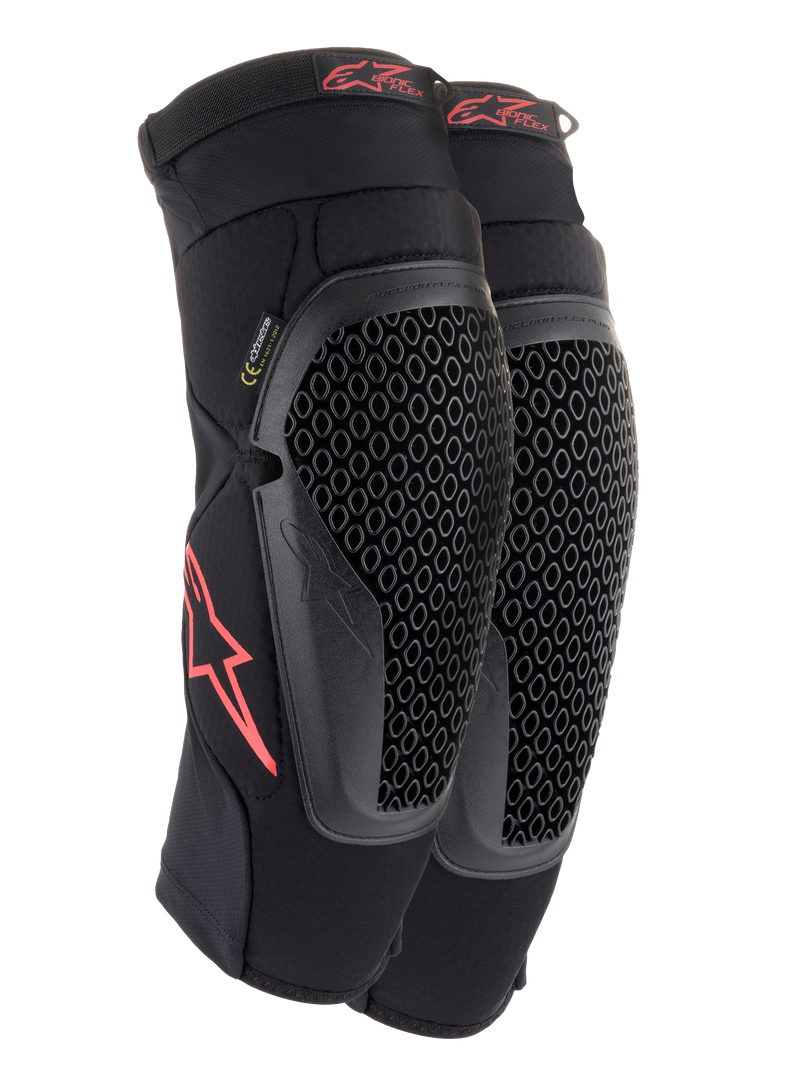 Alpinestars Bionic Flex Knee Protectors, Black and Red, pair of motocross knee guards featuring perforated Nucleon Flex Technology shields, red Astars logos, and elasticated straps on a breathable black mesh sleeve.