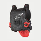 Alpinestars Youth Bionic Tech Protection Jacket, Motocross Protection, Black White and Red, featuring a perforated chest protector with a white star logo, red side buckles, and a ventilated design for off-road racing