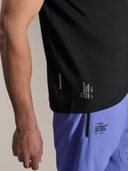 Alpinestars A-Aria Lite Short in Baja Blue, MTB Shorts, featuring screen-printed 'One Goal. One Vision.' branding and zippered pocket, paired with a black A-Aria Switch jersey, close-up view of technical cycling gear.