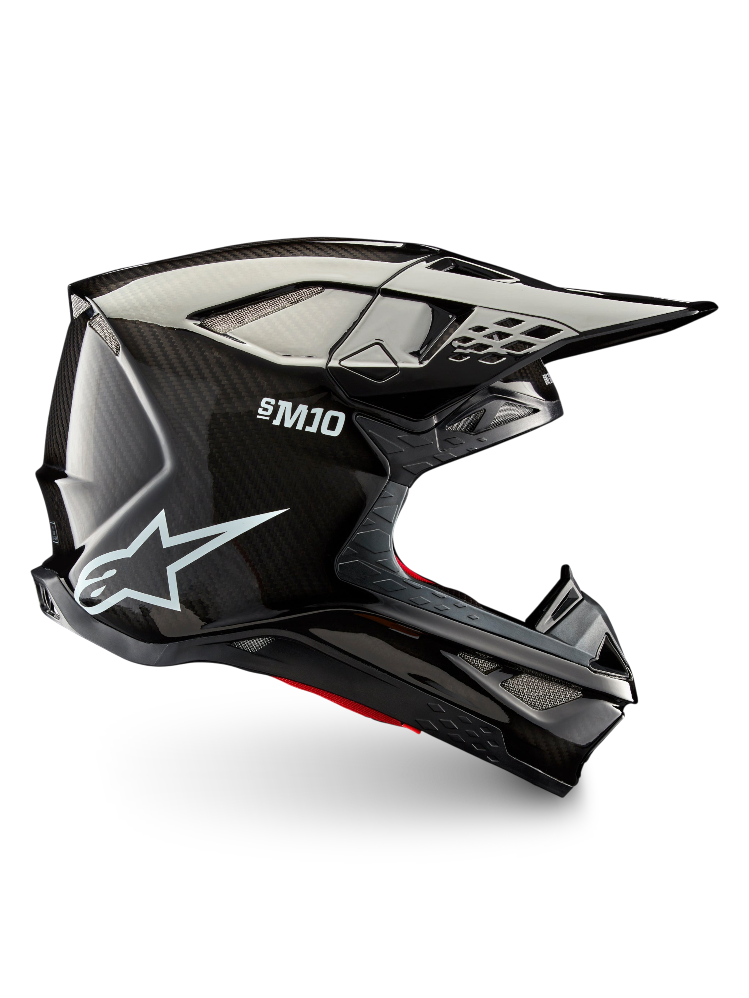 Alpinestars Supertech M10 Solid motocross helmet, side profile in black glossy carbon with carbon shell, peak visor and ventilation ports for off-road riding