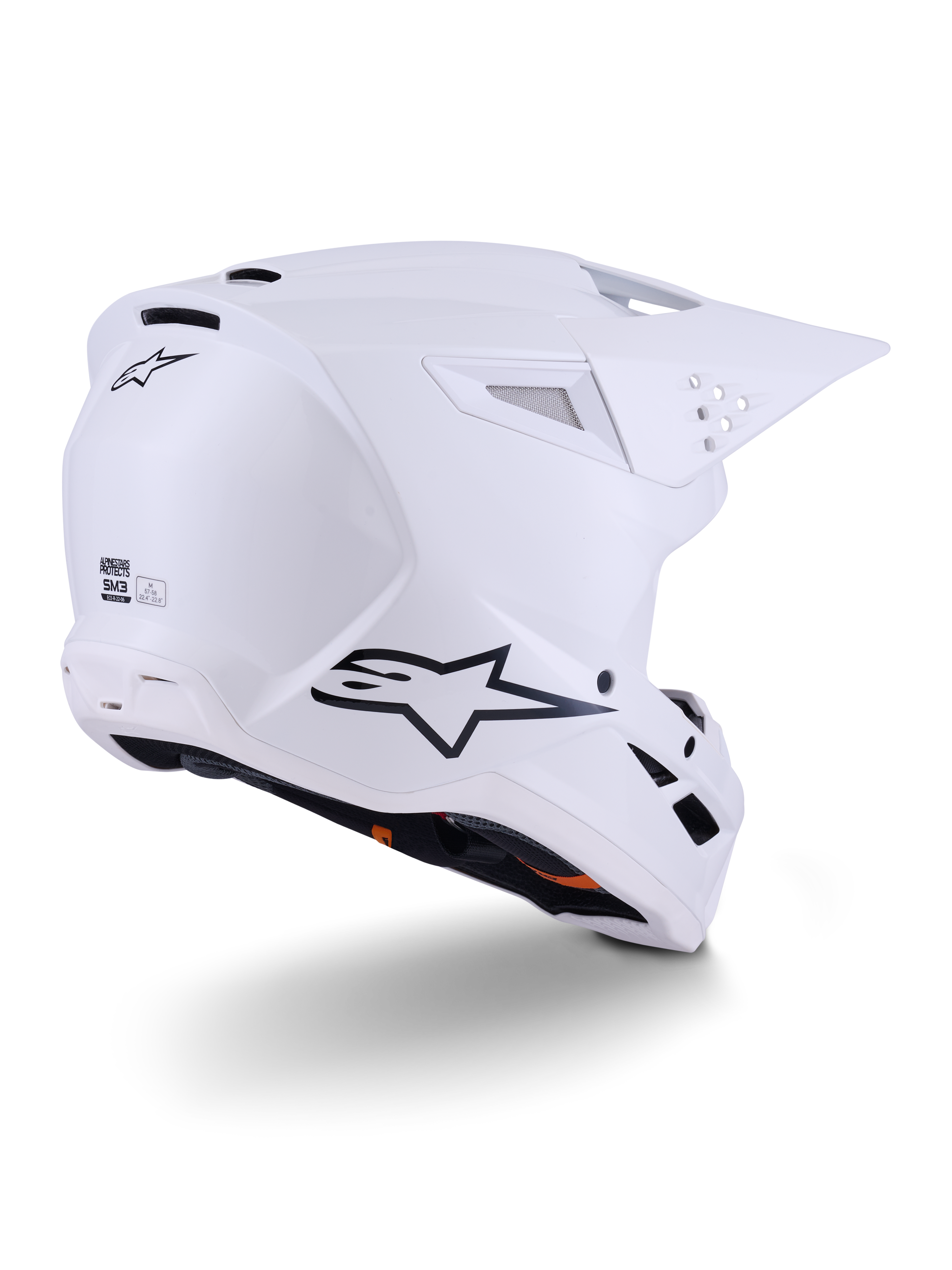 Alpinestars S-M3 Solid Helmet, Motocross Helmet, White Glossy, rear three-quarter view showing black Alpinestars logo, ventilation ports, and aerodynamic shell design for off-road racing.