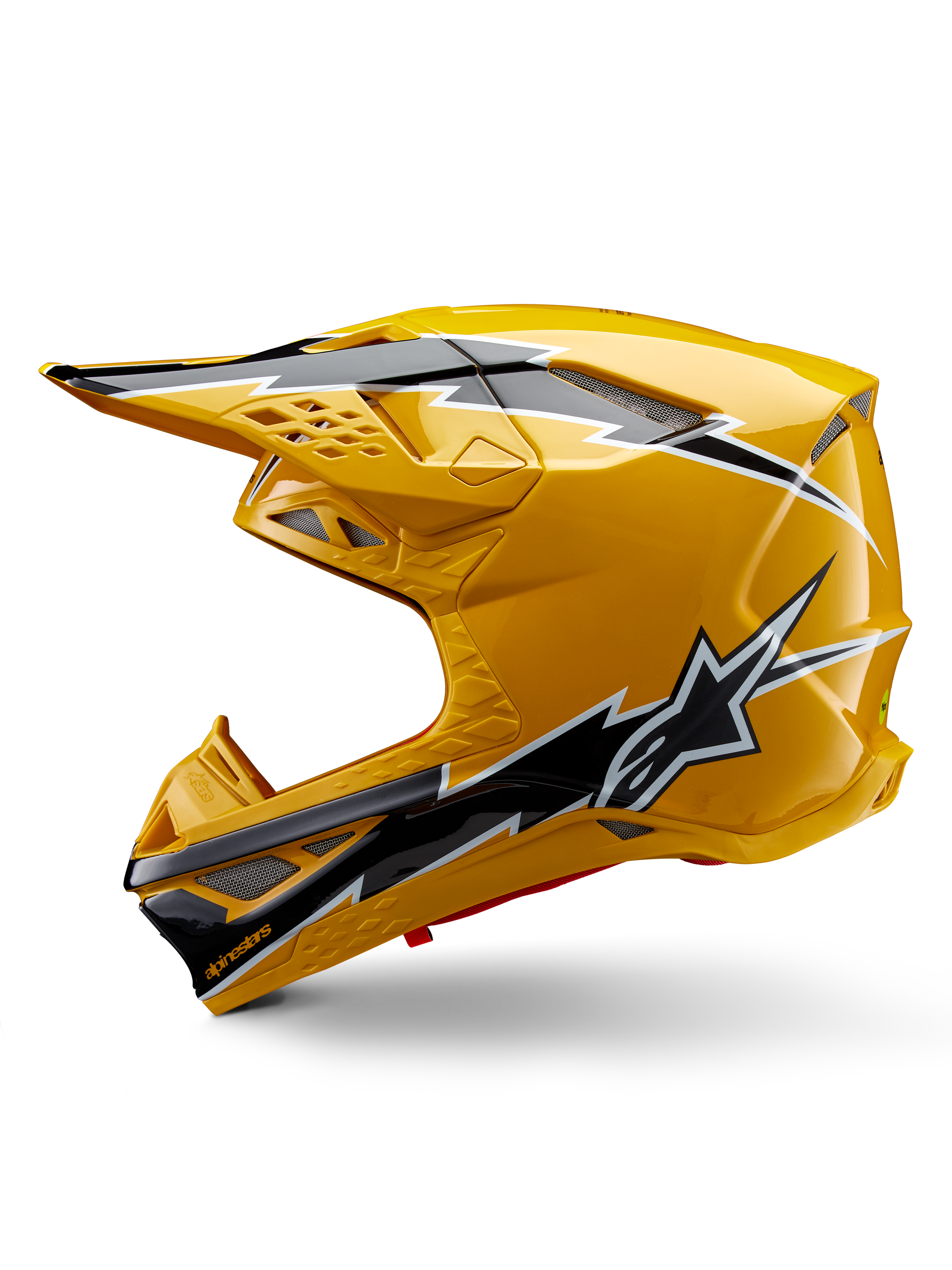 Alpinestars Supertech M10 Ampress Helmet, Motocross Helmet, Glossy Yellow with Black and White Graphics, side view featuring bold angular designs, Alpinestars star logo, and multiple ventilation ports with silver mesh, professional off-road racing gear