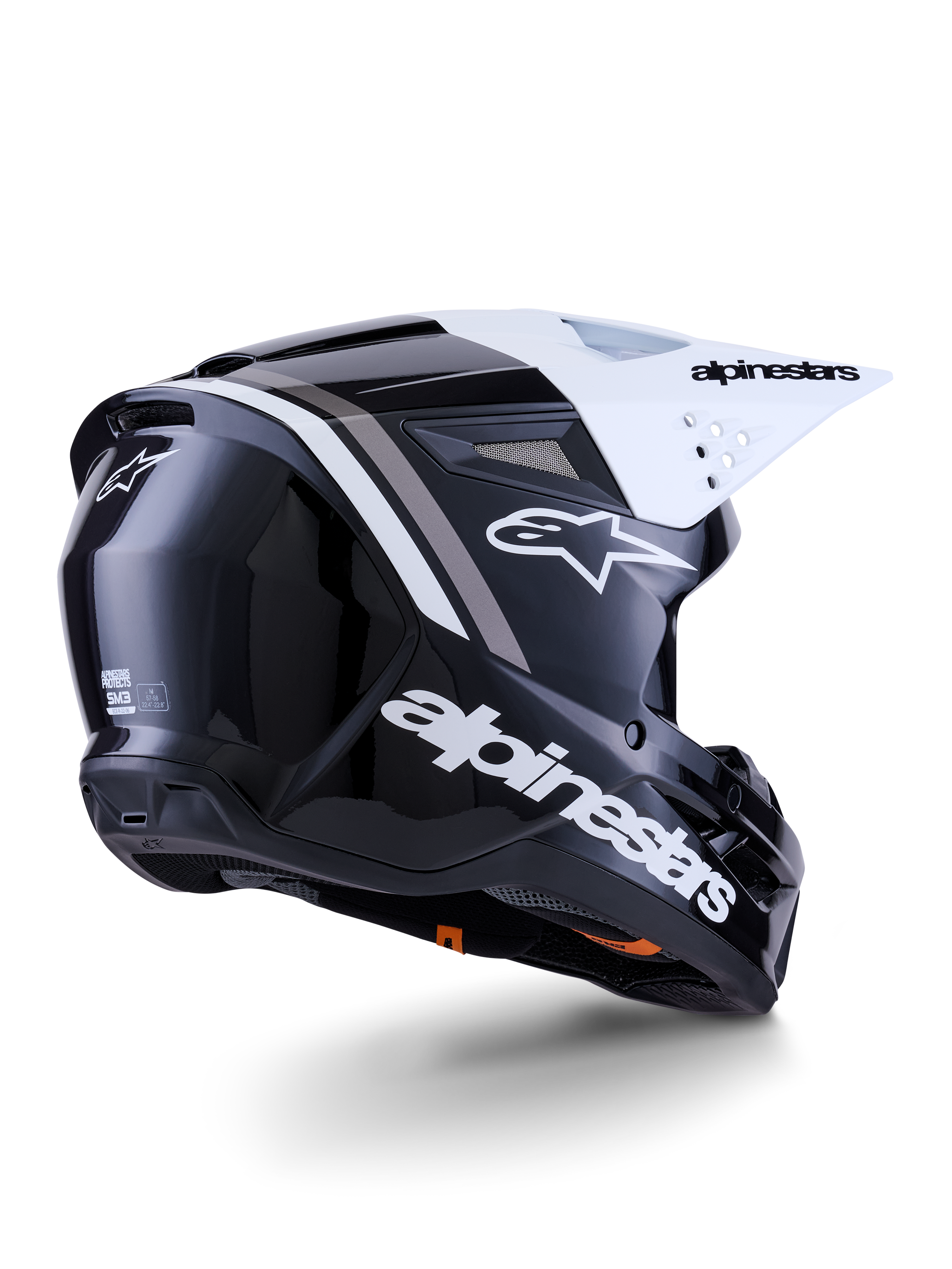 Alpinestars S-M3 Radium Helmet, Motocross Helmet, Black White and Gray Glossy, rear-side view with white visor, featuring bold Alpinestars logo on the side and back, sleek aerodynamic shell with ventilation mesh, designed for off-road motocross and enduro