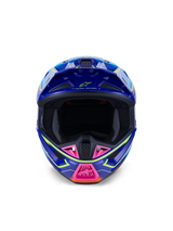 Alpinestars S-M7 Cast Helmet ECE 22.06, Motocross Helmet, Blue Pink and Yellow Fluo Glossy, front-facing view showing aggressive aerodynamic shell, ventilated chin guard with pink accents, and wide eye port for off-road racing