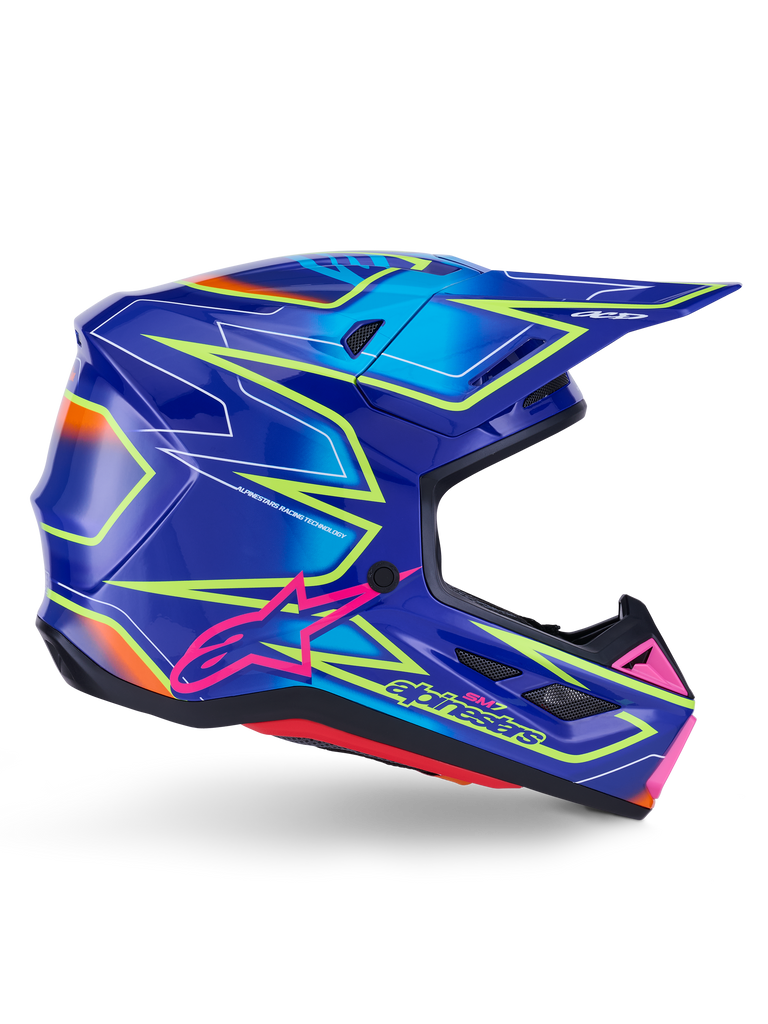 Alpinestars S-M7 Cast Helmet, Motocross Helmet, Blue Pink and Yellow Fluo Glossy, side profile view featuring bold geometric patterns, pink Alpinestars logo, and ventilated aerodynamic shell.