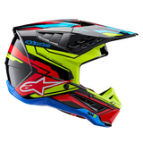 Alpinestars S-M5 Action 2 Helmet ECE, Motocross Helmet, Glossy Black with Yellow Fluo, Bright Red, and Cyan Blue graphics, profile view featuring an aerodynamic shell, ventilated peak, and prominent Alpinestars branding on the side, professional off-road racing protection