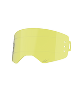 Alpinestars Supertech Roll Off Lens, Motocross Goggle Accessory, Clear Yellow, featuring horizontal glide lines and side attachment points for roll-off systems, curved impact-resistant polycarbonate design