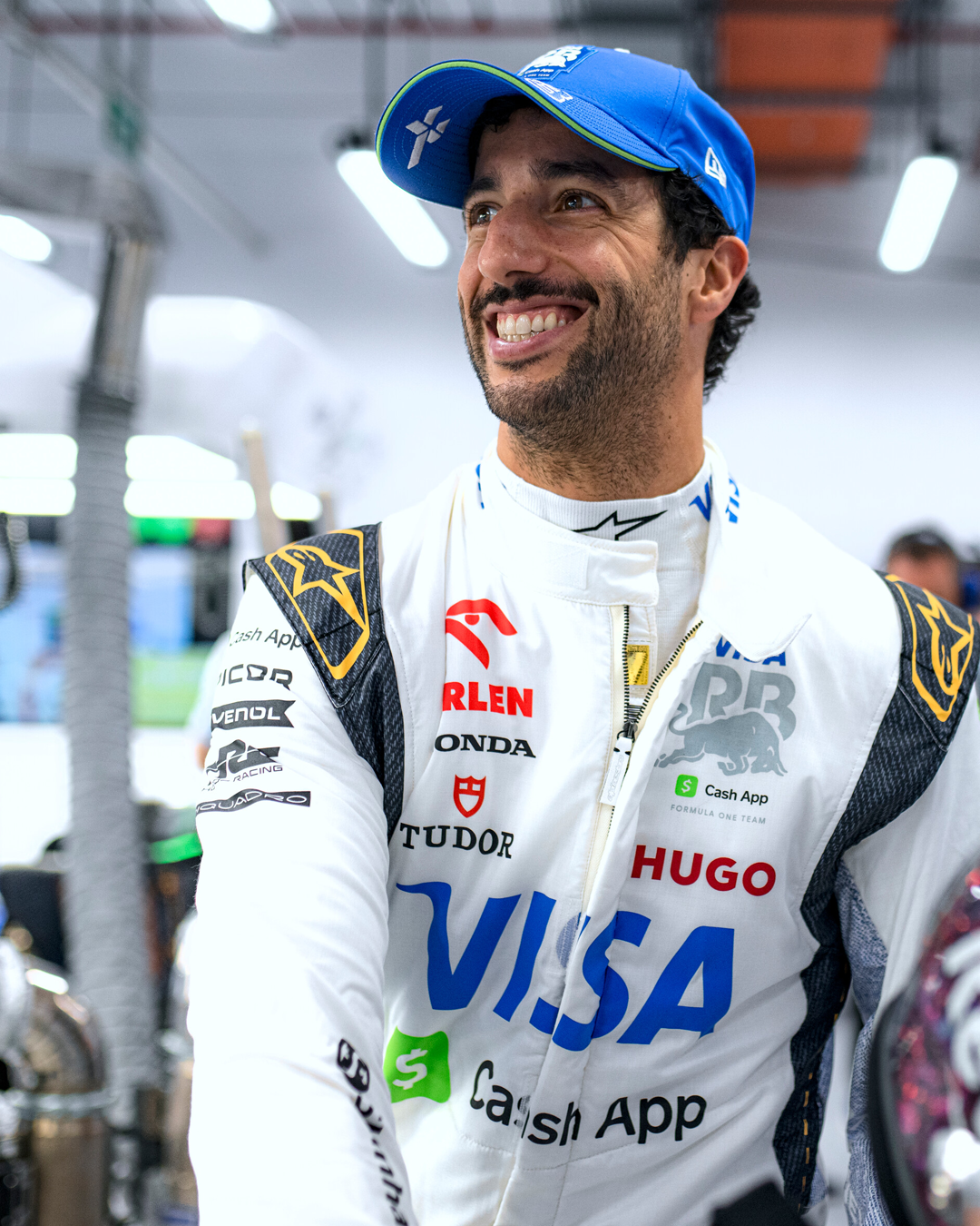 Daniel Ricciardo smiling in the pits