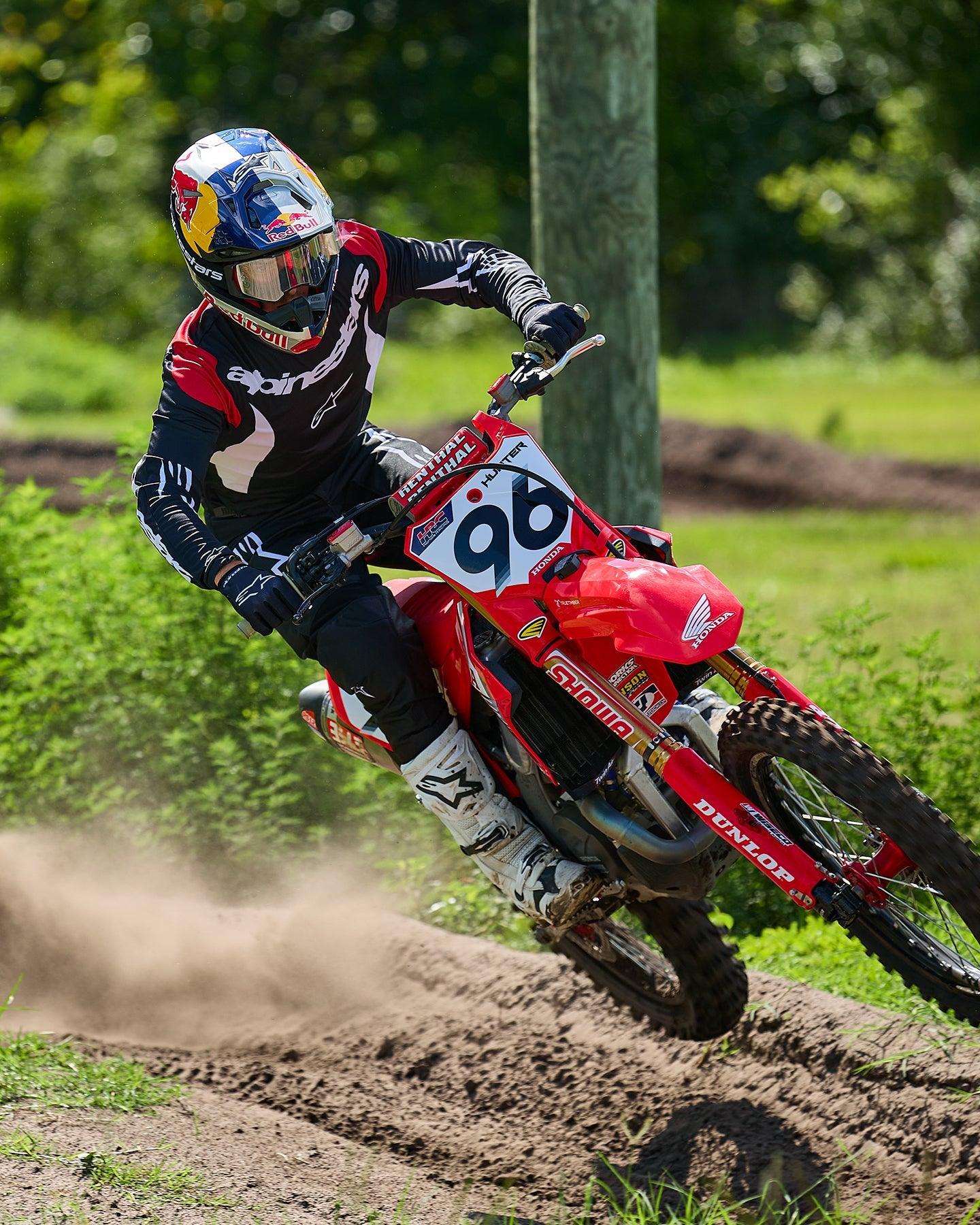 Alpinestars 2025 Fluid Haul Gear Set, black and white motocross jersey and pants, worn by rider 96 on a red Honda bike.