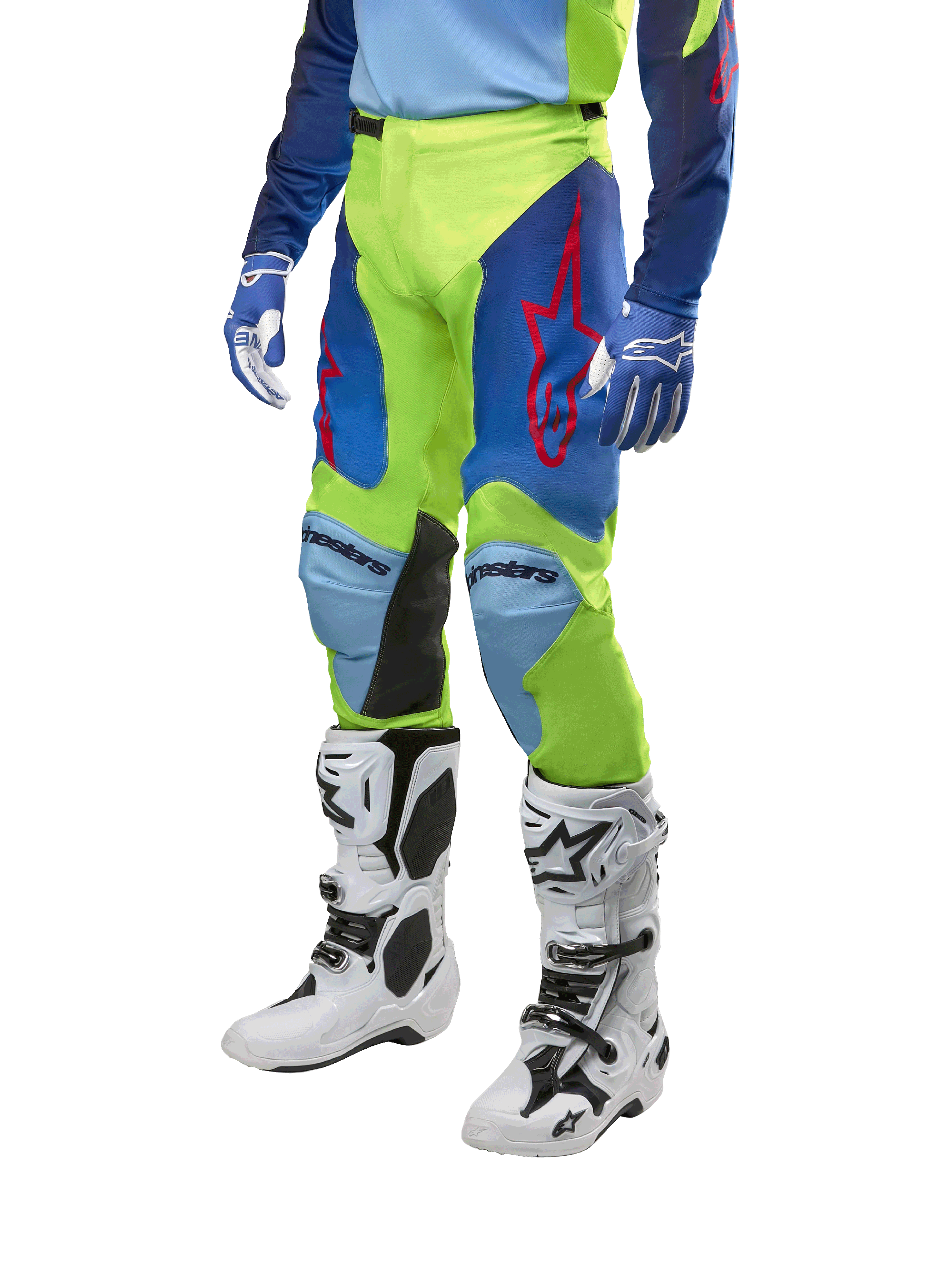 Alpinestars 2024 Racer Hoen Pants, Motocross Pants, Yellow Fluo and Blue Night Navy, featuring red star logos and black inner knee panels, worn with a matching jersey and white motocross boots, performance gear for off-road racing