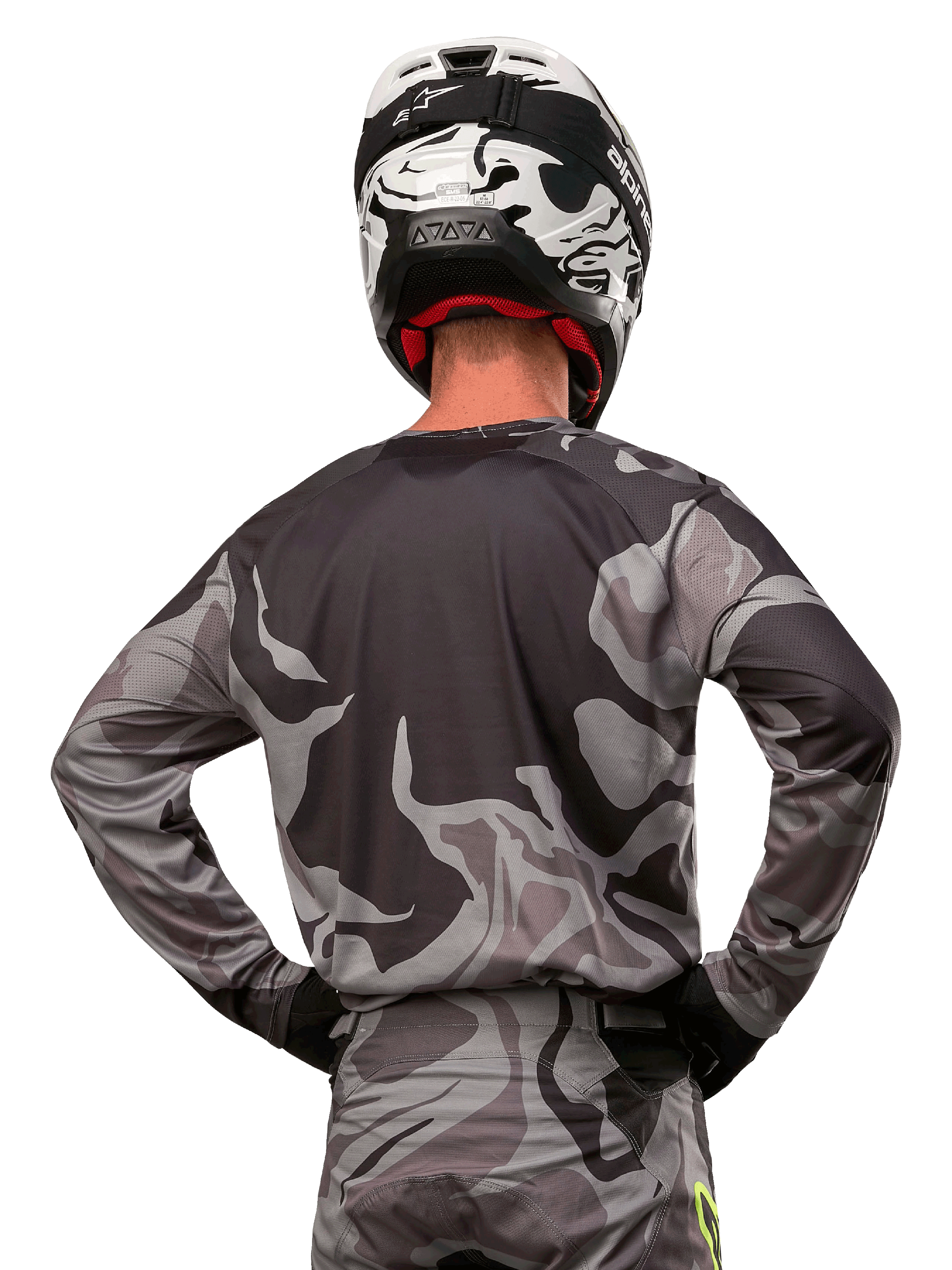 Alpinestars 2024 Racer Tactical Jersey, Motocross Jersey, Cast Gray Camo Magnet, back view showing gray and black camouflage pattern, worn with matching pants and a black and white helmet, professional off-road racing gear