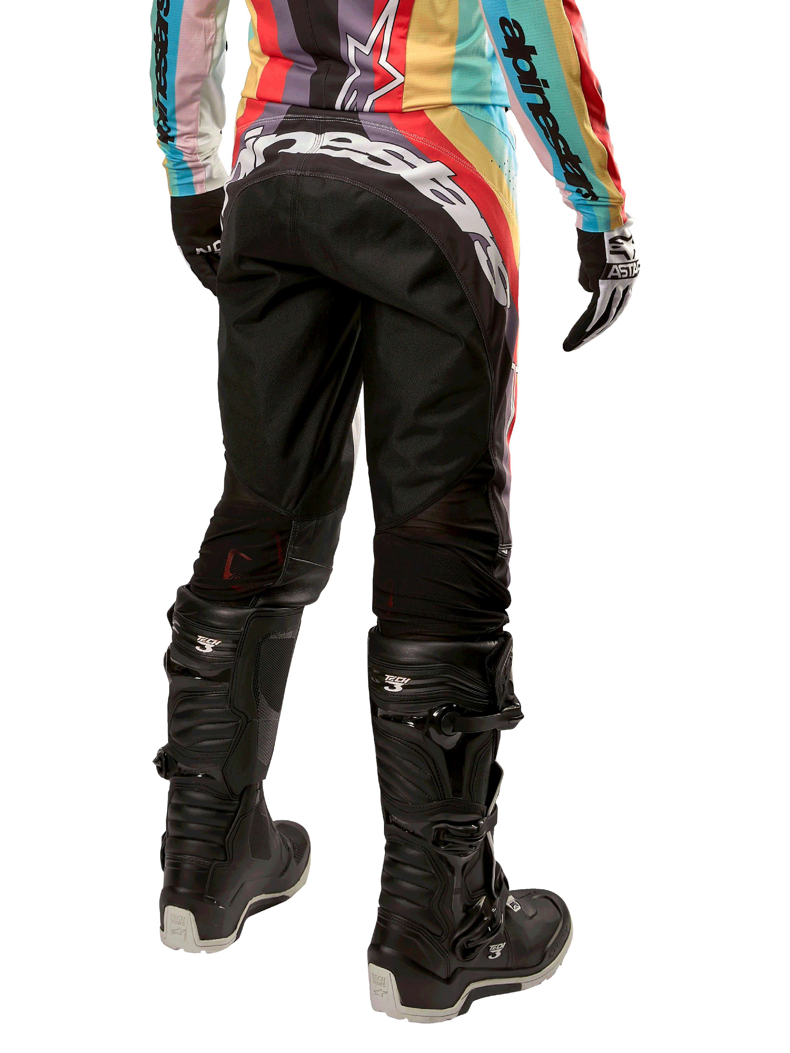 Alpinestars Women Stella 2024 Techstar Pants, Motocross Pants, Black Multicolor, rear view featuring bold white branding across the seat, worn with black Tech 3 boots and a matching multicolor jersey, professional off-road racing apparel.