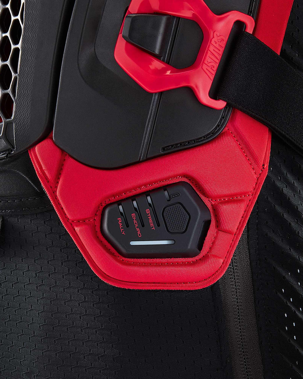 Tech-Air® Off-Road LED display showing Rally, Enduro, and Street modes on a black and red mesh protection jacket.