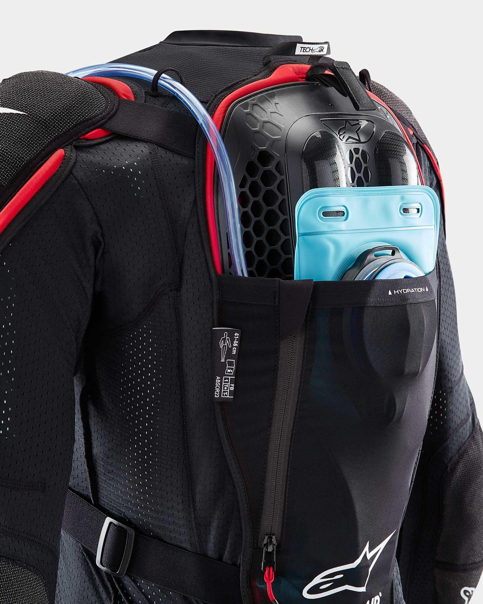 Alpinestars Tech-Air® Off-Road System, black and red mesh jacket with blue hydration bladder and honeycomb back protector.