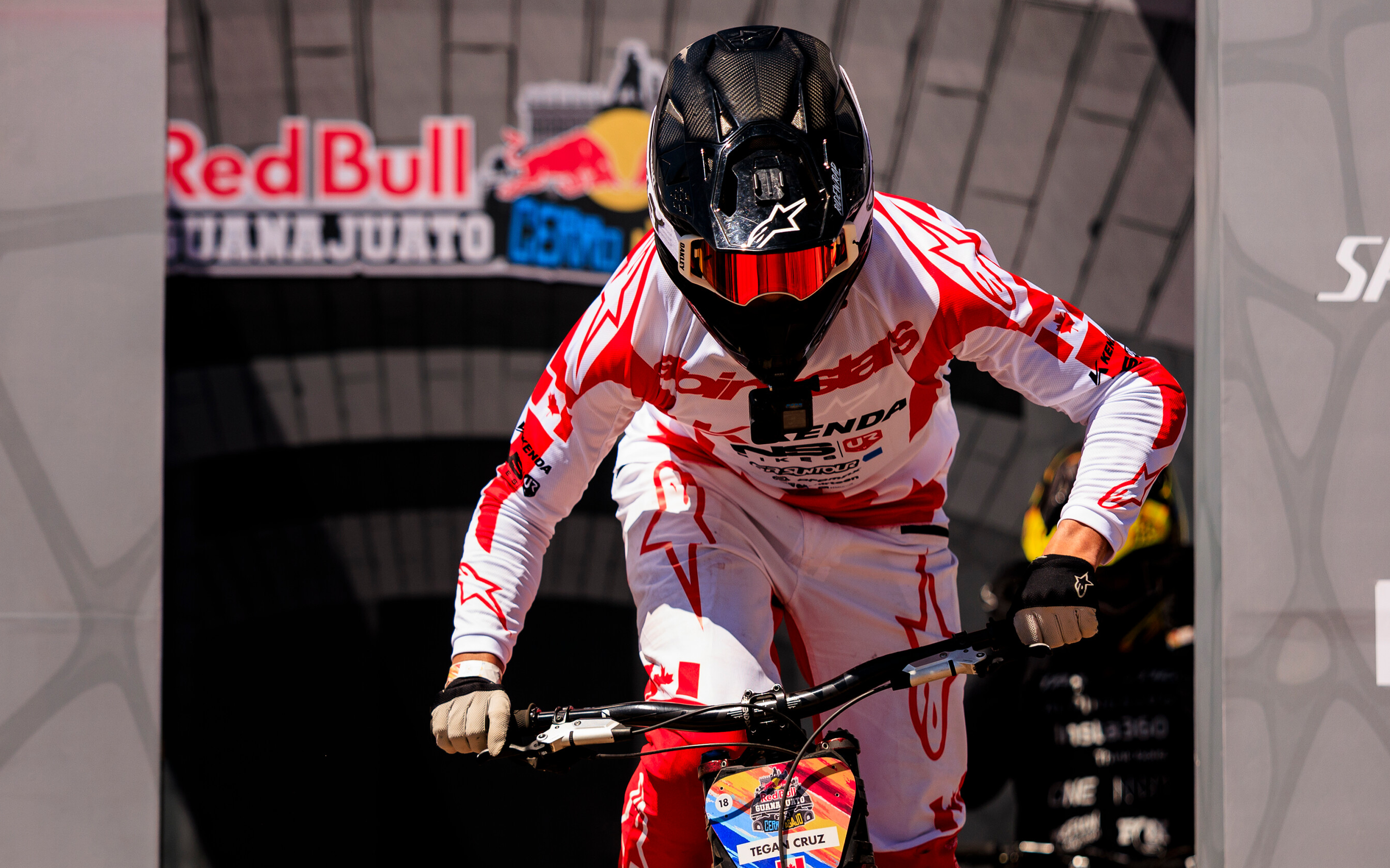 Tegan Cruz wearing Alpinestars head to toe, just off the starting block during a downhill race