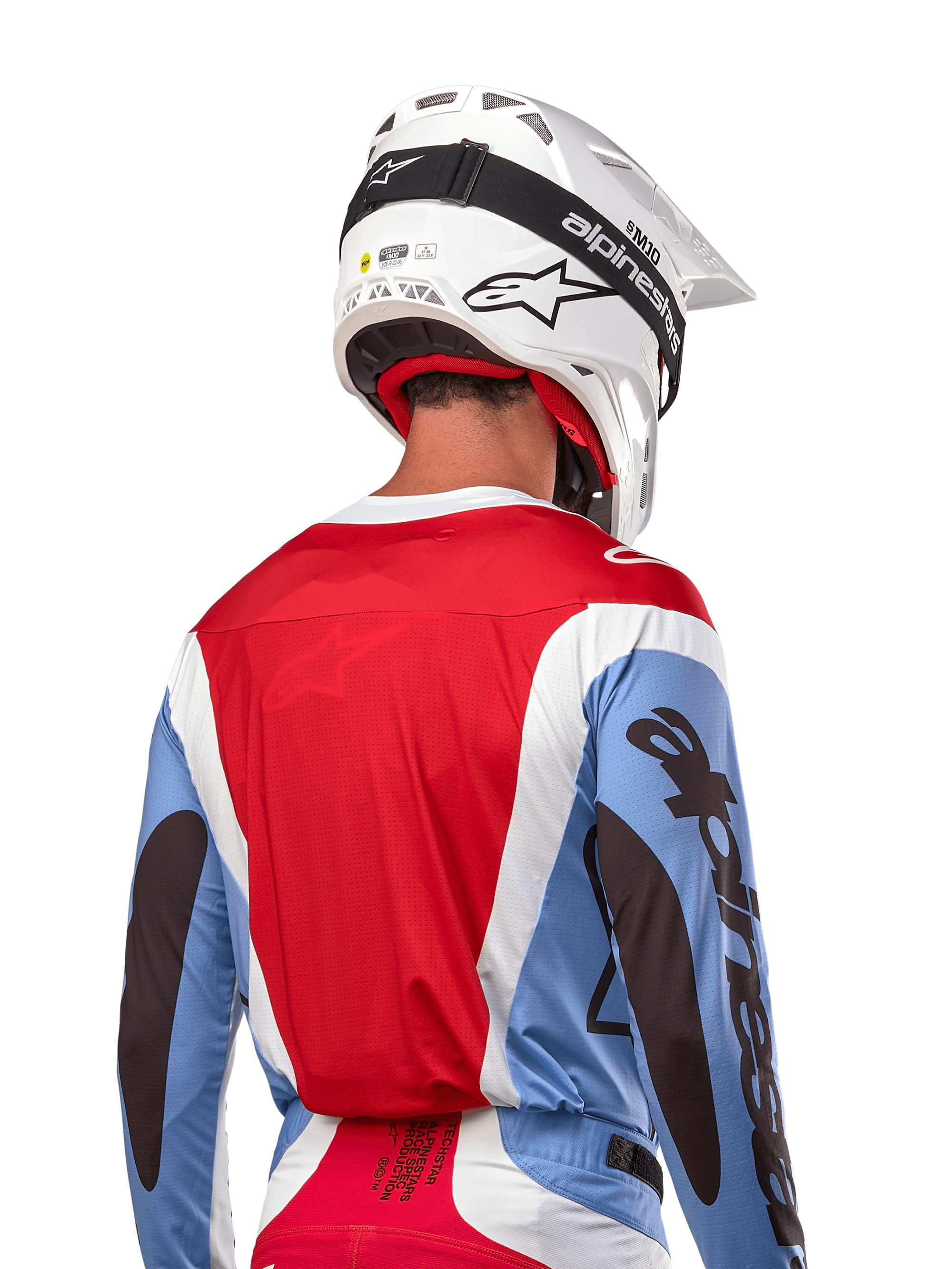 Alpinestars 2024 Techstar Ocuri Jersey, Motocross Jersey, Light Blue, Mars Red and White, rear view of rider wearing matching white helmet and black goggles, features bold black branding on sleeves and ergonomic race fit for off-road performance