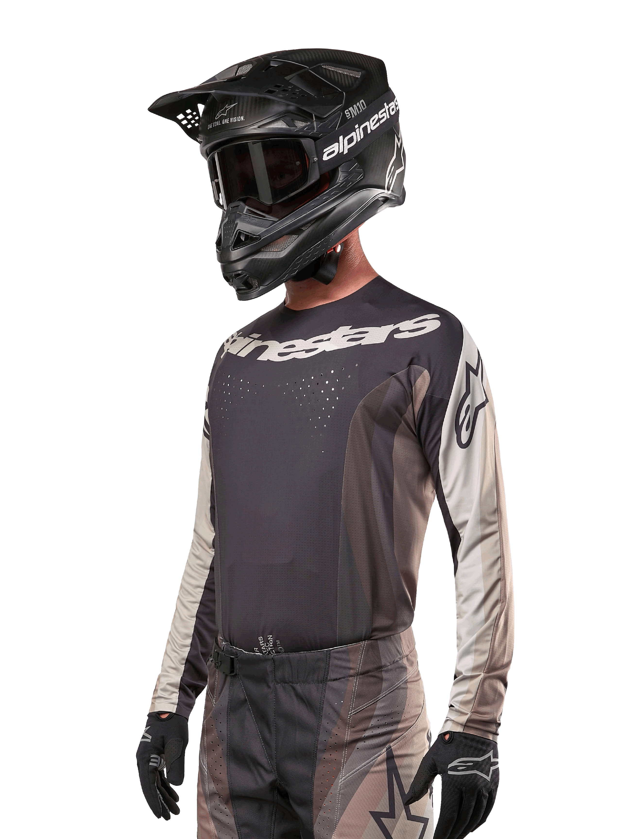 Alpinestars 2024 Techstar Pneuma Jersey, Motocross Racing Jersey, Dark Sand and Iron Dust Gray, long-sleeved performance top with laser-cut perforations and white branding, worn with matching pants and black helmet, athletic fit for off-road riding.