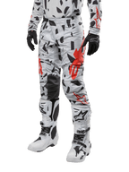 Alpinestars 2024 Techstar Rantera Pants, Motocross Pants, Haze Gray Camo with black and red abstract pattern, worn with matching jersey, black gloves, and white motocross boots, designed for high-performance off-road racing