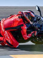 Alpinestars GP Plus V4 Sprint 1PC Leather Suit, Red Fluo and White, Tech-Air ready racing suit on rider in track turn.