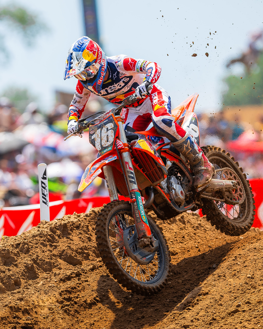 Motocross rider Tom Vialle on a dirt bike wearing full Alpinestars mx gear during a race with a blurred background