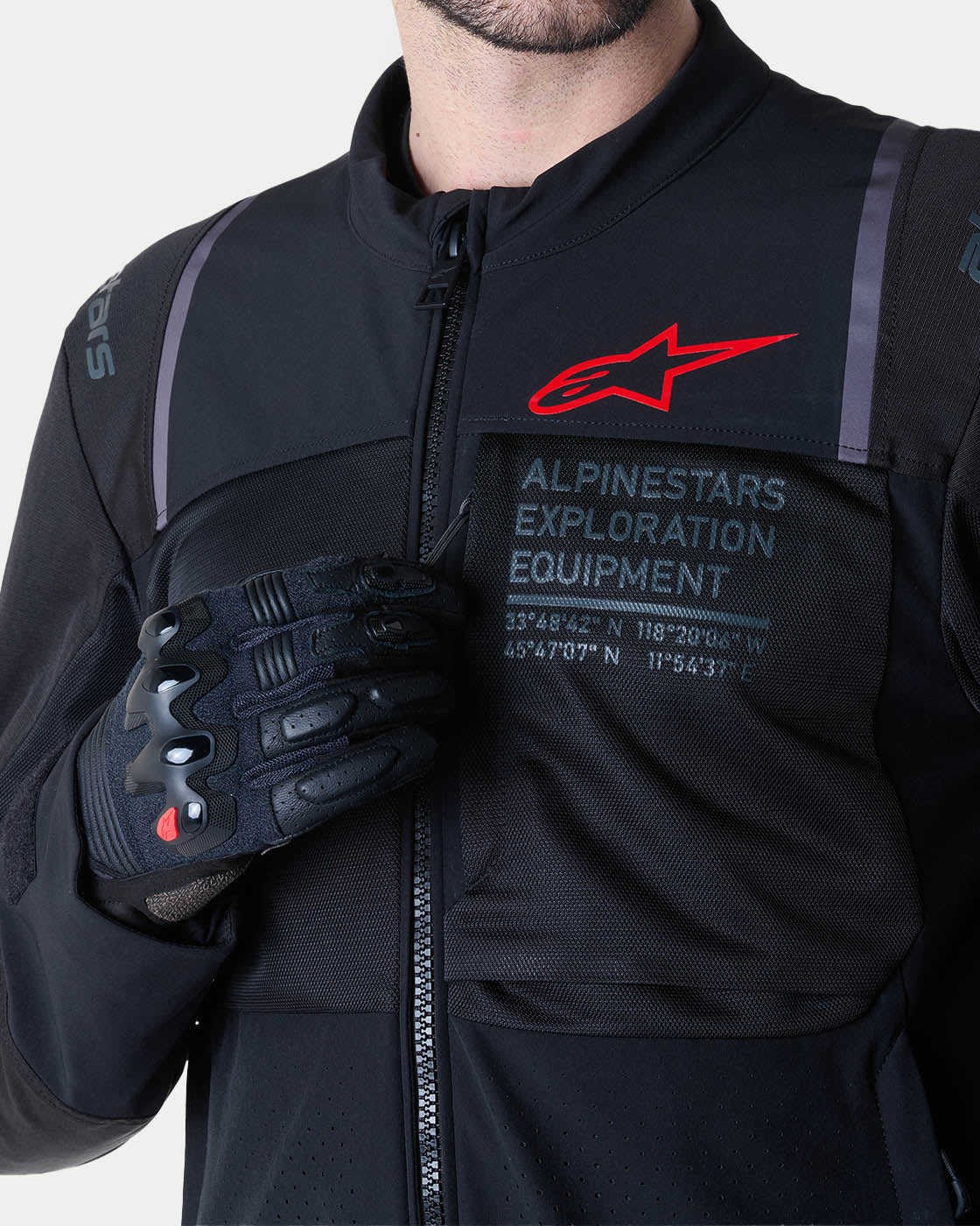 Alpinestars ST-2 Air Jacket, black motorcycle touring jacket with mesh panels, red logo, and exploration branding.