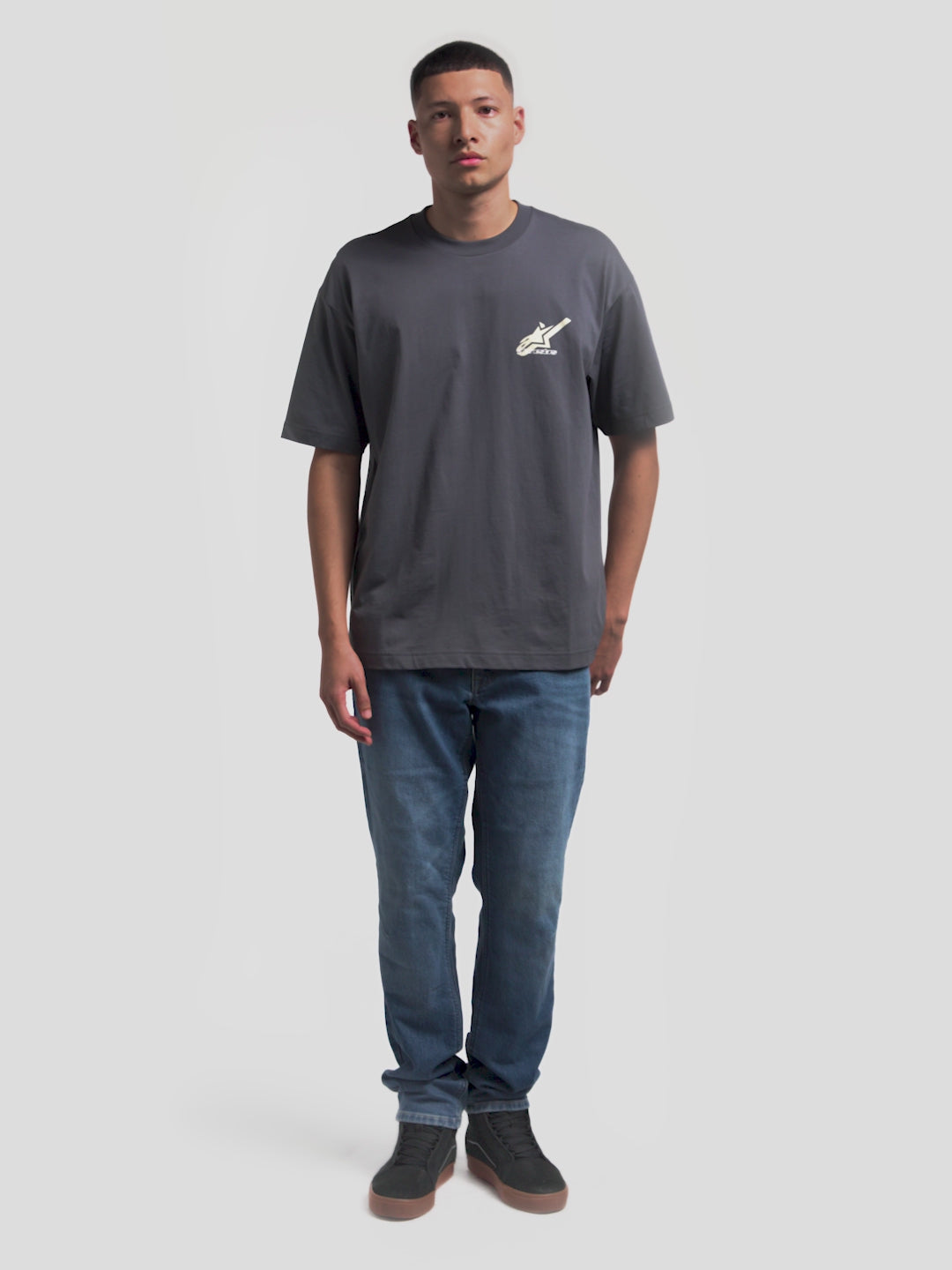 Alpinestars Ghost Oversized CSF Tee, Men's Casual Short Sleeve Sportswear T-Shirt, Charcoal Gray, featuring front and back logo graphics with 'Racing Ahead' text, oversized fit, soft cotton-polyester fabric.